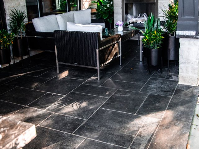 Backyard patio with jet black natural stone