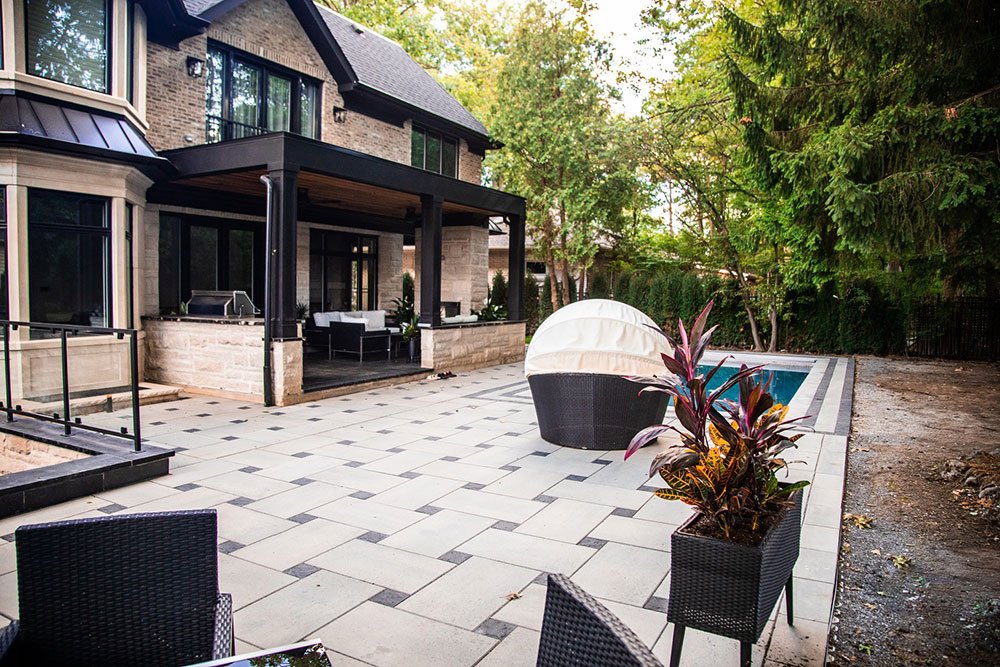 Landscaping the Whole House with Both Interlocking Pavers and Exposed Aggregate Concrete