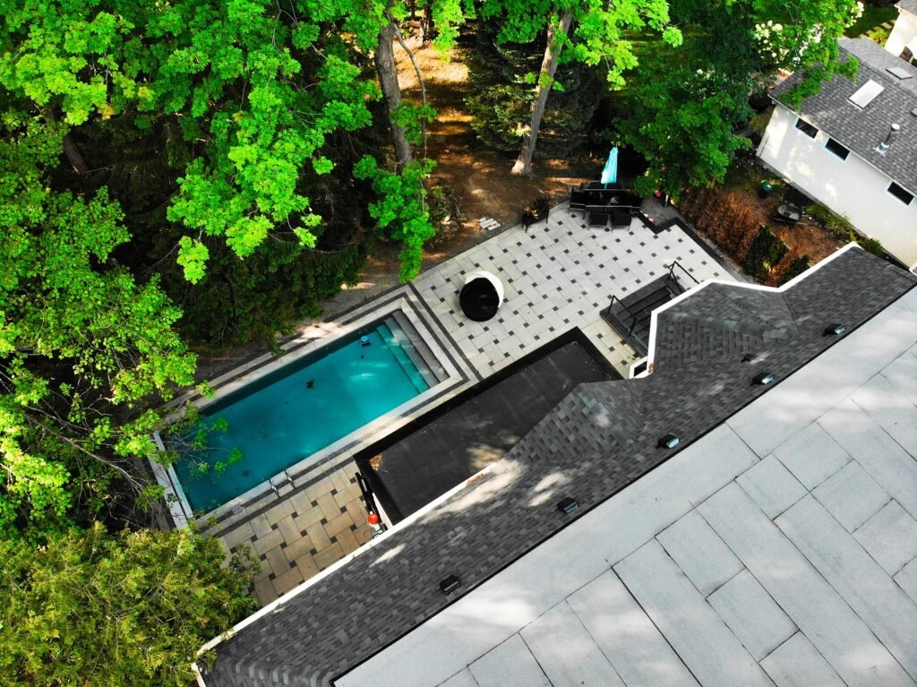Outdoor Makeover with Exposed Aggregate Concrete Driveway and Interlocking Back Patio
