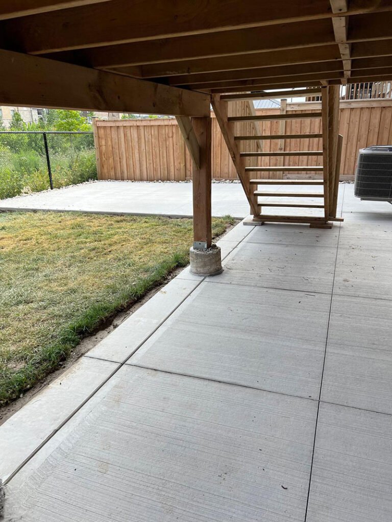 Backyard patio with brushed concrete