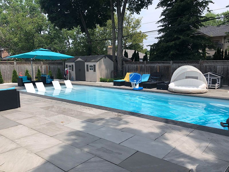 Fibreglass pool with interlocking pool deck in Etobicoke