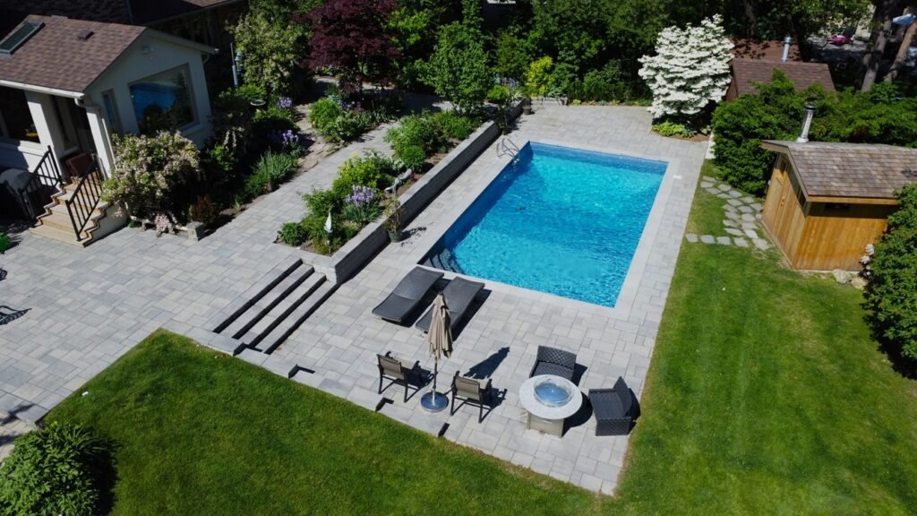 Elevating the Backyard with Interlocking Pool Deck and Garden Oasis